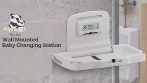 Wall mounted diaper changing station installed in a commercial restroom
